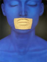 Blue Man Is Holding A Yellow Paper In His Mouth